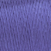 Close-up of Jagger Brothers, Inc. JaggerSpun Maine Line 2/20 Yarn in purple, featuring a soft and textured appearance. The worsted spun fibers are tightly wound, forming a diagonal pattern that highlights the rich color and intricate details of the wool yarn.