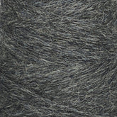 A close-up view of the JaggerSpun Heather 2/8 large cone from Jagger Brothers, Inc. reveals thick, dark gray yarn with a textured and slightly fuzzy appearance. The strands are tightly wound together, showcasing its worsted spun quality.