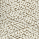 Close-up image of a ball of off-white JaggerSpun Heather 2/8 yarns by Jagger Brothers, Inc., showing the tightly wound strands in a crisscross pattern. The texture of the worsted spun wool is clearly visible, highlighting its fibrous and slightly coarse appearance.