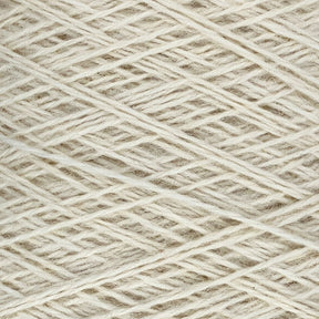 Close-up image of a ball of off-white JaggerSpun Heather 2/8 yarns by Jagger Brothers, Inc., showing the tightly wound strands in a crisscross pattern. The texture of the worsted spun wool is clearly visible, highlighting its fibrous and slightly coarse appearance.