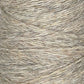 Close-up image of JaggerSpun Heather 2/8 | Mini-cone yarns from Jagger Brothers, Inc., wound tightly into a cylindrical shape. The texture appears slightly coarse, with fibers of varying shades of beige and light brown interwoven together, highlighting the beauty of worsted spun wool processed with low-impact synthetic dyes.