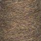 A close-up image of a mini-cone of JaggerSpun Heather 2/8 yarn by Jagger Brothers, Inc., showcasing detailed texture and fibers. The yarn, tightly wound with diagonal lines, combines brown and gray hues. The rustic and earthy appearance is enhanced by the use of low-impact synthetic dyes.