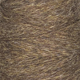 A close-up image of a mini-cone of JaggerSpun Heather 2/8 yarn by Jagger Brothers, Inc., showcasing detailed texture and fibers. The yarn, tightly wound with diagonal lines, combines brown and gray hues. The rustic and earthy appearance is enhanced by the use of low-impact synthetic dyes.