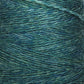 Close-up of a mini-cone of JaggerSpun Heather 2/8 yarn from Jagger Brothers, Inc., showcasing the detailed texture of the fibers. The worsted spun wool yarn features subtle variations of blue and green hues created using low-impact synthetic dyes, giving it a rich, blended appearance.