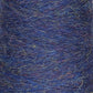 Close-up image of a spool of Jagger Brothers, Inc. JaggerSpun Heather 2/8 Mini-cone yarns showcasing a textured blend of blue, purple, and subtle green fibers. The intertwined strands create a thick, fuzzy appearance, suggesting its suitability for knitting or crochet projects.