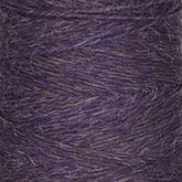 A close-up of a spool of Jagger Brothers, Inc.'s JaggerSpun Heather 2/8 yarn in purple. The texture is clearly visible, showing the intertwined fibers and subtle variations in the purple hue, created using low-impact synthetic dyes for a slightly heathered appearance. The yarn looks soft and slightly fuzzy.