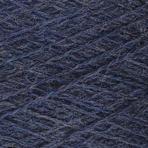 Close-up image of dark blue JaggerSpun Heather 2/8 Mini-cone yarns from Jagger Brothers, Inc. wound tightly in a crisscross pattern, highlighting the texture and detailed fibers.