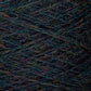 Close-up image of a multi-colored skein of JaggerSpun Heather 2/8 | Mini-cone by Jagger Brothers, Inc., featuring tightly wound strands with visible fibers. The various colors blend together, creating a textured pattern in hues of blue, green, red, purple, and orange using low-impact synthetic dyes.