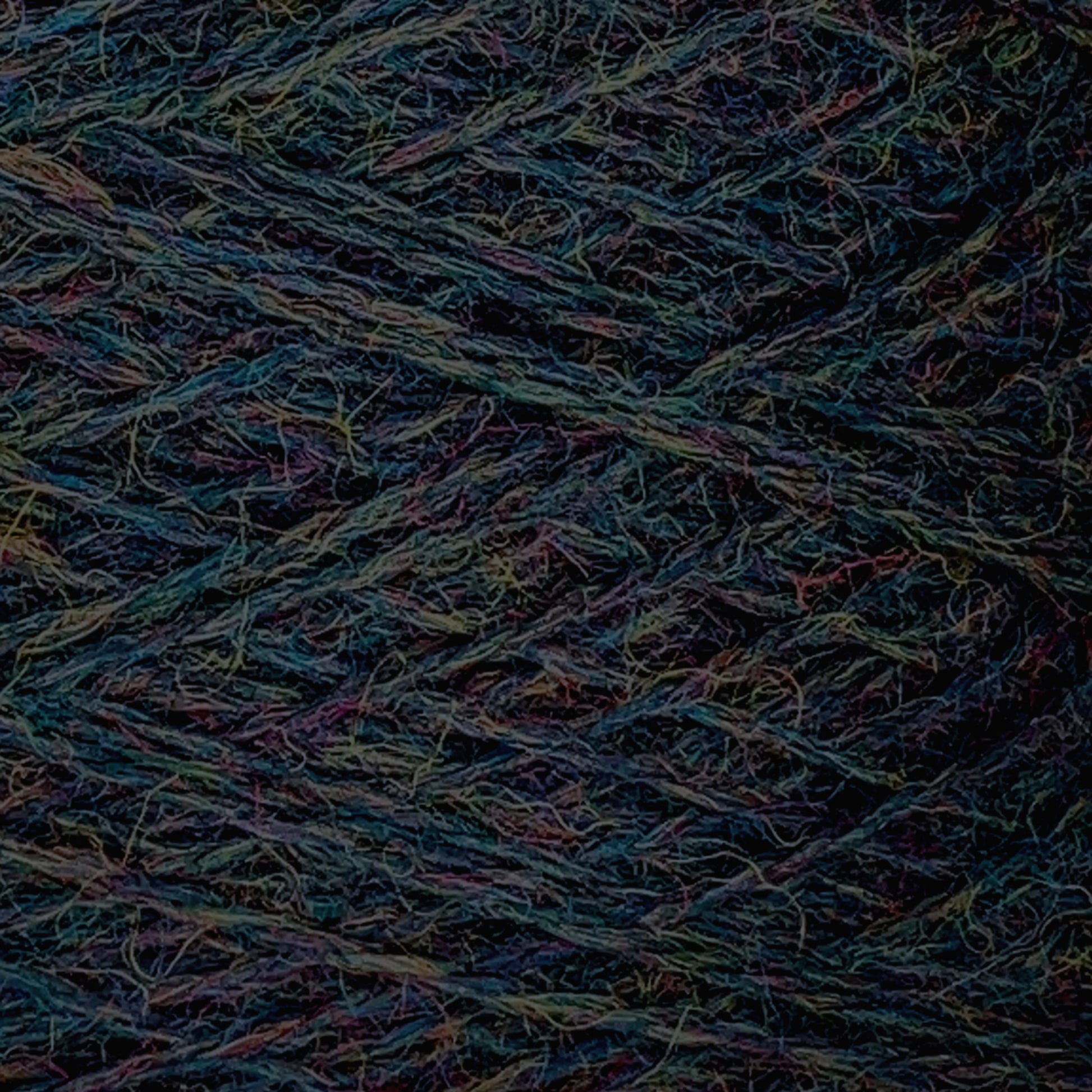 Close-up image of a multi-colored skein of JaggerSpun Heather 2/8 | Mini-cone by Jagger Brothers, Inc., featuring tightly wound strands with visible fibers. The various colors blend together, creating a textured pattern in hues of blue, green, red, purple, and orange using low-impact synthetic dyes.