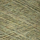 Close-up view of Jagger Brothers, Inc. JaggerSpun Heather 2/8 Mini-cone yarns with subtle variations in color, showcasing the individual fibers and texture. The worsted spun wool is crisscrossed, creating a layered and textured appearance.