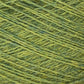 Close-up image of JaggerSpun Heather 2/8 Mini-cone yarns by Jagger Brothers, Inc., showcasing the detailed texture and interwoven fibers. This worsted spun wool, dyed with low-impact synthetic dyes, features shades of green ranging from light to medium, with visible strands intertwined in a consistent pattern.