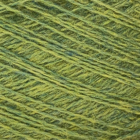 Close-up view of JaggerSpun Heather 2/8 yarn by Jagger Brothers, Inc., wound around itself, showcasing its texture and fiber strands in detail. This worsted spun yarn exhibits subtle variations in color tones, ranging from light to medium yellow-green, exemplifying the quality of JaggerSpun yarns.