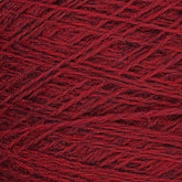 Close-up image of a ball of red yarn. The Jagger Brothers, Inc. JaggerSpun Heather 2/8 Mini-cone yarns are tightly wound, showcasing a detailed texture with strands of various shades of red intertwined.