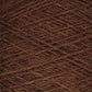 A close-up image of a ball of Jagger Brothers, Inc.'s JaggerSpun Heather 2/8 Mini-cone yarn features tightly wound threads in various shades of brown. The rough and slightly fuzzy texture indicates it is composed of natural fibers and dyed with low-impact synthetic dyes. The crisscross pattern gives an intricate view of overlapping strands.