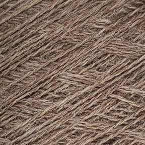 Close-up image of tightly woven natural brown fiber or yarn, showcasing the intricate texture and interlocking strands in a crisscross pattern. The material appears coarse with varying shades of brown throughout, reminiscent of high-quality Jagger Brothers, Inc.'s JaggerSpun Heather 2/8 yarn on a large cone.