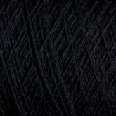 Close-up image of tightly wound dark grey JaggerSpun Superfine Merino 2/18 Yarn | Mini-cone by Jagger Brothers, Inc., featuring a soft texture and forming a dense, crisscross pattern. The fibers appear smooth and slightly fuzzy, with a subtle color gradient ranging from deep charcoal to lighter grey tones—ideal for hand knitters' projects.