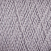 Close-up view of a ball of light gray Jagger Brothers, Inc. JaggerSpun Superfine Merino 2/18 Yarn | Mini-cone, showing tightly wound strands crisscrossing in various directions. The fine fibers create a textured, soft surface, perfect for knitting or crocheting projects.