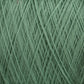 Close-up image of a mini-cone of light green Jagger Brothers, Inc.'s JaggerSpun Superfine Merino 2/18 Yarn, showcasing the texture and interwoven strands. The fibers appear soft and consistent in thickness, making them ideal for knitting or crocheting projects. The worsted spun yarn ensures a smooth finish, perfect for hand knitters.