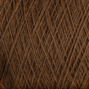 A close-up view of the JaggerSpun Superfine Merino 2/18 Yarn by Jagger Brothers, Inc., reveals brown merino wool fibers intricately woven in a criss-cross pattern. The worsted weight texture appears soft and dense, with visible strands creating a detailed and textured appearance. Perfect for discerning hand knitters seeking quality material.