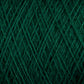 A close-up image of the JaggerSpun Superfine Merino 2/18 Yarn in green, showing intricate crisscrossing fibers and textured patterns. The yarn, produced by Jagger Brothers, Inc., appears to be tightly wound, highlighting the detailed and uniform structure of the threads. This large cone is perfect for hand knitters seeking quality material.