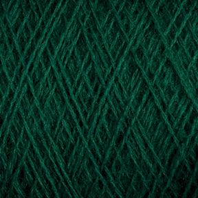 A close-up image of the JaggerSpun Superfine Merino 2/18 Yarn in green, showing intricate crisscrossing fibers and textured patterns. The yarn, produced by Jagger Brothers, Inc., appears to be tightly wound, highlighting the detailed and uniform structure of the threads. This large cone is perfect for hand knitters seeking quality material.