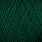 Close-up of dark green JaggerSpun Superfine Merino 2/18 Yarn | Mini-cone by Jagger Brothers, Inc. intertwined in a crisscross pattern. The texture appears soft and slightly fuzzy, showcasing the fiber detail and structure of a thick yarn ball.