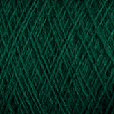 Close-up of dark green JaggerSpun Superfine Merino 2/18 Yarn | Mini-cone by Jagger Brothers, Inc. intertwined in a crisscross pattern. The texture appears soft and slightly fuzzy, showcasing the fiber detail and structure of a thick yarn ball.