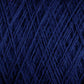 Close-up view of JaggerSpun Superfine Merino 2/18 Yarn | Mini-cone by Jagger Brothers, Inc., showcasing the intricate, crisscrossed texture and pattern of the dark blue Merino wool fibers wound tightly together.