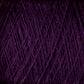 A close-up image of dark purple JaggerSpun Superfine Merino 2/18 Yarn | Mini-cone by Jagger Brothers, Inc., showcasing the texture and strands tightly wound together. The superfine Merino fibers appear soft and thick, creating a rich, intertwined pattern perfect for hand knitters.