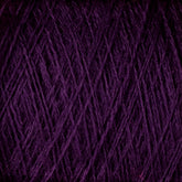 Close-up image of tightly wound JaggerSpun Superfine Merino 2/18 Yarn in purple by Jagger Brothers, Inc., showcasing its visible fibrous texture and strands. The yarn appears dense and intricately overlapping, forming a complex pattern of crisscrossing lines, perfect for hand knitters seeking worsted weight material.