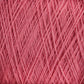 Close-up image of JaggerSpun Superfine Merino 2/18 Yarn | Mini-cone by Jagger Brothers, Inc., showcasing the pink worsted spun Merino wool yarn with tightly wound fibers in a crisscross pattern, creating a textured and detailed view of the material. The yarn appears soft and slightly fuzzy.