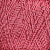 Close-up image of JaggerSpun Superfine Merino 2/18 Yarn | Mini-cone by Jagger Brothers, Inc., showcasing the pink worsted spun Merino wool yarn with tightly wound fibers in a crisscross pattern, creating a textured and detailed view of the material. The yarn appears soft and slightly fuzzy.