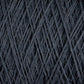 Close-up image of dark grey JaggerSpun Superfine Merino 2/18 Yarn by Jagger Brothers, Inc., wound tightly in a mini-cone, showcasing the intricate crisscross pattern of the fibers. The texture appears soft and slightly fuzzy, highlighting the fibrous nature of this hand knitters yarn.