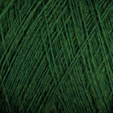 Close-up of JaggerSpun Superfine Merino 2/18 Yarn | Large Cone from Jagger Brothers, Inc., displaying green merino wool yarn strands tightly wound together, creating a textured pattern. The yarn appears slightly fuzzy and is uniformly colored, perfect for hand knitters seeking a worsted weight option.