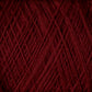 A close-up image of a tightly wound skein of JaggerSpun Superfine Merino 2/18 Yarn from Jagger Brothers, Inc., in a rich deep red hue, revealing the texture and strands of the fibers. The intersecting lines form a pattern that showcases the thickness and consistency treasured by hand knitters.