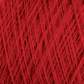 Close-up of a tightly wound spool of JaggerSpun Zephyr Wool-Silk 2/18 Yarn from Jagger Brothers, Inc., showcasing the intricate and crisscrossing fibers. The texture is prominent, with individual strands visible, highlighting the detailed weave and vibrant color on this large cone.