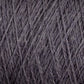 Close-up of a textured surface showing tightly woven, dark gray yarn. The intricate crisscross pattern and soft fibers are clearly visible, highlighting the detailed craftsmanship and material quality of this luxurious JaggerSpun Zephyr Wool-Silk 2/18 Yarn from Jagger Brothers, Inc.