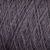 Close-up of a textured surface showing tightly woven, dark gray yarn. The intricate crisscross pattern and soft fibers are clearly visible, highlighting the detailed craftsmanship and material quality of this luxurious JaggerSpun Zephyr Wool-Silk 2/18 Yarn from Jagger Brothers, Inc.