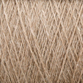 Close-up image of JaggerSpun Zephyr Wool-Silk 2/18 Yarn by Jagger Brothers, Inc. in beige, showcasing tightly interwoven fibers forming a textured, crisscross pattern. The natural wool and silk fibers appear sophisticated and slightly lustrous, blending the luxurious qualities of high-end yarn with an intricately detailed design.