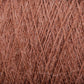 A close-up image of light brown JaggerSpun Zephyr Wool-Silk 2/18 Yarn by Jagger Brothers, Inc., showcasing its soft and fibrous texture. The image highlights the intricate weave pattern and individual fibers, emphasizing the material's warmth and fluffiness, embodying the elegance of luxurious yarn crafted from a blend of Australian merino wool and silk.