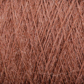 A close-up image of light brown JaggerSpun Zephyr Wool-Silk 2/18 Yarn by Jagger Brothers, Inc., showcasing its soft and fibrous texture. The image highlights the intricate weave pattern and individual fibers, emphasizing the material's warmth and fluffiness, embodying the elegance of luxurious yarn crafted from a blend of Australian merino wool and silk.