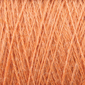 Close-up view of JaggerSpun Zephyr Wool-Silk 2/18 Yarn | Large Cone by Jagger Brothers, Inc., showcasing its detailed and intertwined fibers. The texture appears soft and slightly fuzzy, with the strands crisscrossing in a neat and consistent pattern.