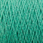 Close-up of JaggerSpun Zephyr Wool-Silk 2/18 Yarn in turquoise, showcasing interwoven fibers and intricate cross-hatch patterning. The slightly fuzzy strands emphasize the softness of this luxurious yarn, crafted by Jagger Brothers, Inc. from a blend of superfine merino wool and silk. The color is vibrant and evenly distributed throughout the fibers.