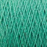 Close-up of JaggerSpun Zephyr Wool-Silk 2/18 Yarn in turquoise, showcasing interwoven fibers and intricate cross-hatch patterning. The slightly fuzzy strands emphasize the softness of this luxurious yarn, crafted by Jagger Brothers, Inc. from a blend of superfine merino wool and silk. The color is vibrant and evenly distributed throughout the fibers.