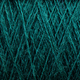 Close-up of the intricate texture of a teal-colored JaggerSpun Zephyr Wool-Silk 2/18 Yarn | Mini-cone by Jagger Brothers, Inc. The fibers are tightly woven with crisscrossing patterns, creating a rich, detailed surface. The vibrant color enhances the texture, making this luxurious yarn appear both soft and sturdy.