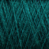 Close-up view of JaggerSpun Zephyr Wool-Silk 2/18 Yarn by Jagger Brothers, Inc., wound tightly in a crisscross pattern, showcasing the texture and intricate arrangement of the fibers. The image highlights the detailed and fibrous nature of the yarn, with a rich, emerald green color throughout.