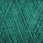 A close-up image of luxurious JaggerSpun Zephyr Wool-Silk 2/18 Yarn | Mini-cone, showcasing its tightly woven fibers and texture. The green yarn appears to be made of dense, slightly shiny material, likely a blend of superfine merino wool and silk, suitable for knitting or crocheting projects.