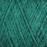 A close-up image of luxurious JaggerSpun Zephyr Wool-Silk 2/18 Yarn | Mini-cone, showcasing its tightly woven fibers and texture. The green yarn appears to be made of dense, slightly shiny material, likely a blend of superfine merino wool and silk, suitable for knitting or crocheting projects.