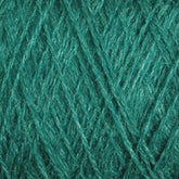 Close-up of green strands interwoven to form a dense, textured pattern. The luxurious JaggerSpun Zephyr Wool-Silk 2/18 Yarn from Jagger Brothers, Inc. appears soft and has a slight sheen, giving it a vibrant look. The individual fibers are visible, highlighting the detailed craftsmanship.