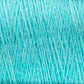 Close-up of light blue JaggerSpun Zephyr Wool-Silk 2/18 Yarn from Jagger Brothers, Inc., showcasing the luxurious yarn fibers intertwined in a crisscross pattern that highlights the detailed texture and softness of the material. The threads appear thick and are tightly knitted together on this large cone.